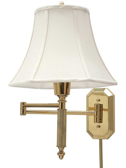 Cornelia Swing-Arm Wall Lamp in Polished Brass.